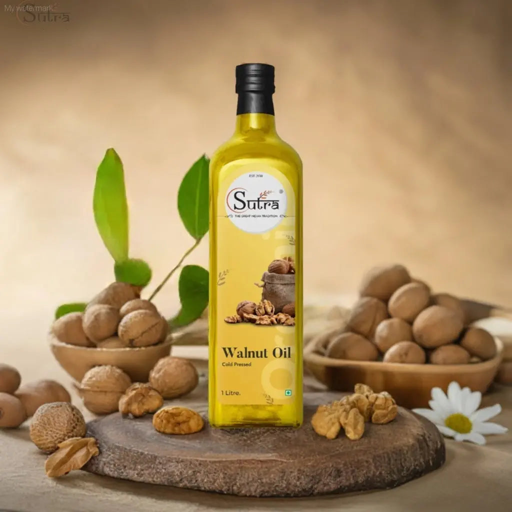 Sutra Wooden Cold Pressed Walnut Oil bottle on a wooden platter with walnuts and leaves in the background.