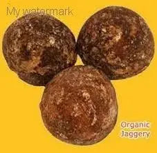 Organic jaggery powder balls on a yellow background, natural sweetener for healthy living.