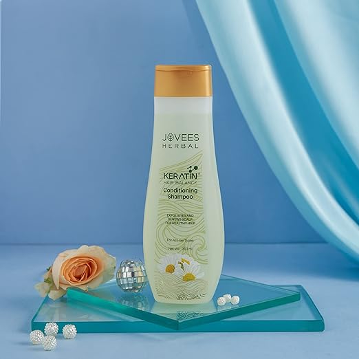 Natural Jovees shampoo bottle with herbal ingredients for hair care.