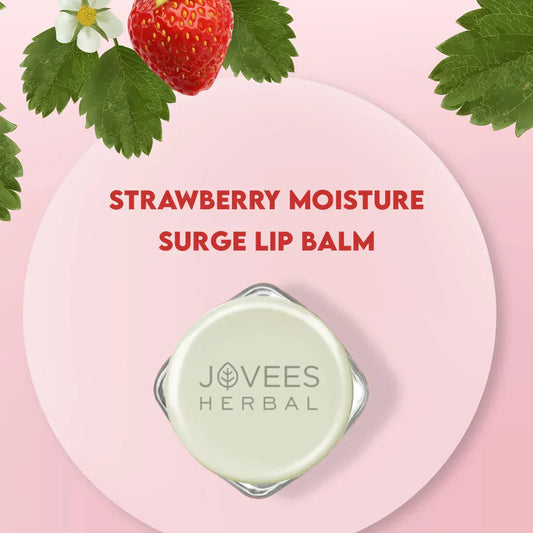 Jovees Strawberry Moisture Surge Lip Balm packaging with strawberry and leaves, providing hydration and softness for lips.