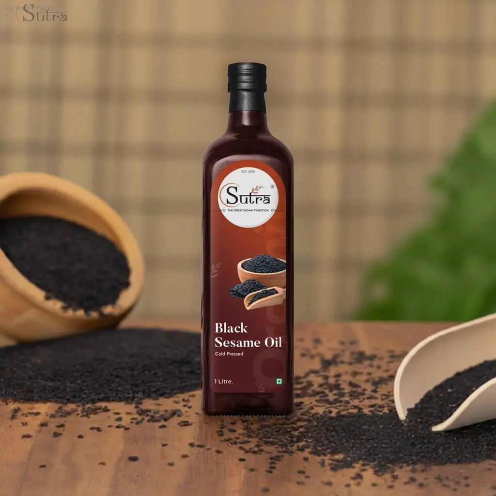 Sutra Wooden Cold Pressed Black sesame oil bottle with black sesame seeds; cold-pressed, wood-pressed for healthy cooking.